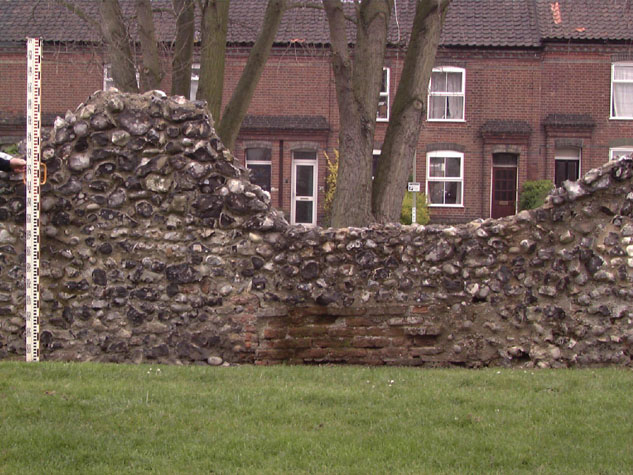 Inside of wall towards east end