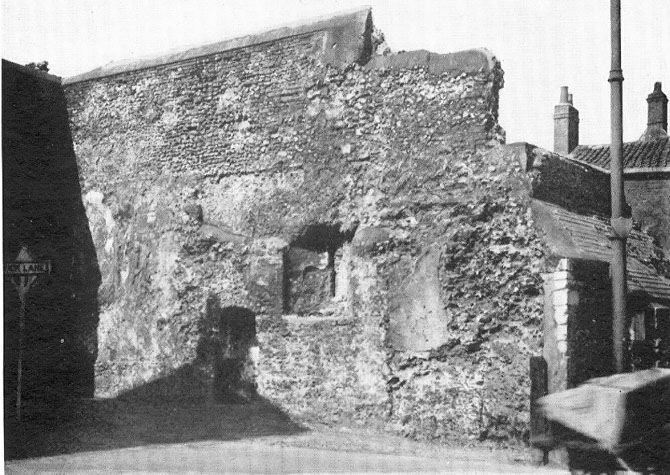 The remains of St Benedict's Gate and the wall and buildings along Duck Wall Lane