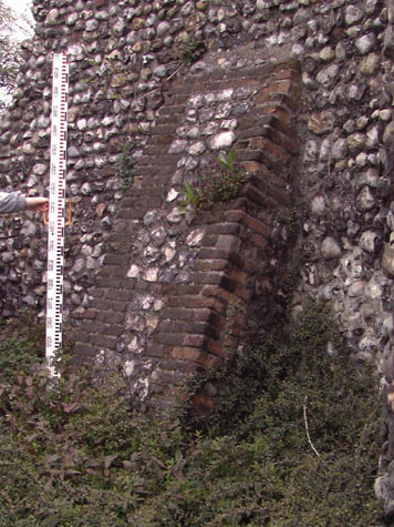 Buttress on the external or west face of the wall immediately north of the tower