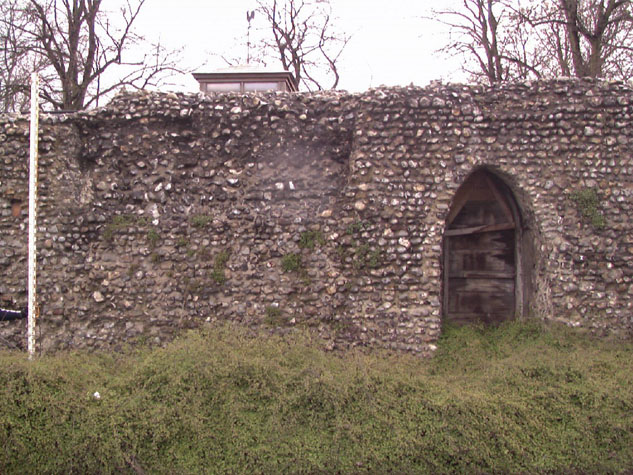 Archway through the wall south of the tower from the outer or west side