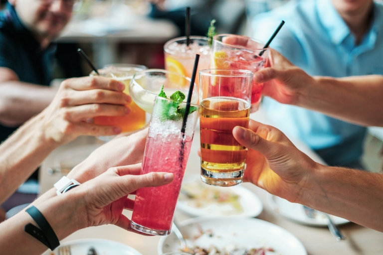 People toasting with alcoholic drinks