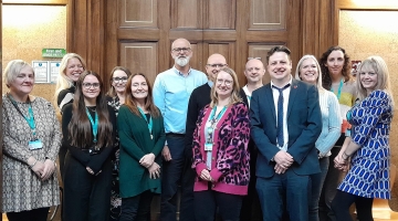 Team members posing at City Hall