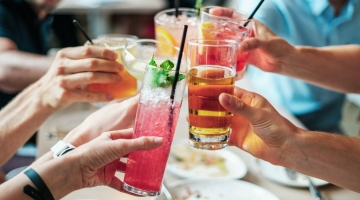 People toasting with alcoholic drinks